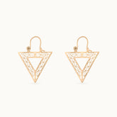 Close up of Modern downward-facing triangular hoops plated in 18k gold, named Golden Vertex. Lightweight and hypoallergenic, perfect for a bold yet minimalist look